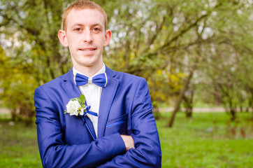 groom in a blue suit