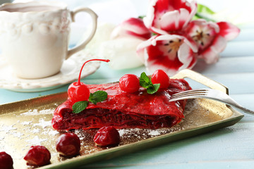 Cherry strudel with mint and cup of tea