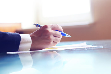Businessman signing a document