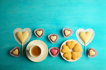 Valentine concept. Composition of cookies and candies on blue background