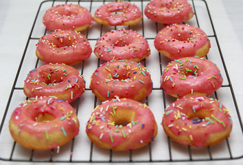 Pink icing doughnut with Sprinkles Isolated on White Background