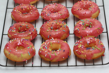 Pink icing doughnut with Sprinkles Isolated on White Background