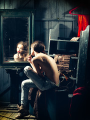 Obraz na płótnie Canvas Sensual girl near mirror