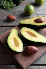 Sliced avocado on wooden cutting board © Africa Studio