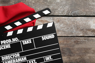 Movie clapper on wooden background