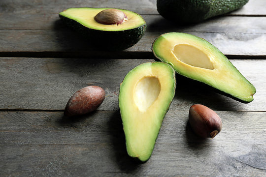 Sliced avocado on wooden table