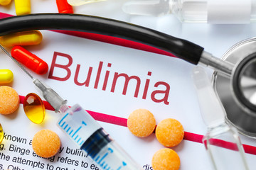 Medicines and Bulimia diagnosis written on paper closeup