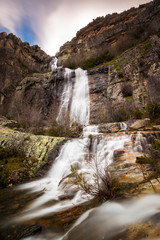 Naklejka na ściany i meble Despenalagua waterfall in Valverde de los Arroyos, Guadalajara (Spain)