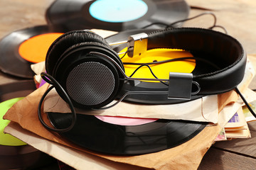 Fototapeta na wymiar Vinyl records and headphones on table