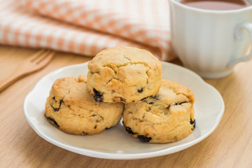 Scones on plate and cup of tea