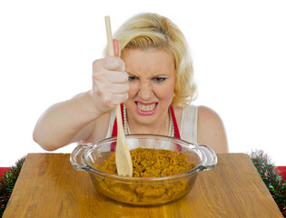 angry woman mixing cookie dough.