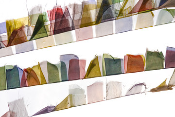 Buddhist prayer flags fluttering on the wind