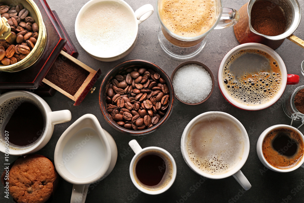 Poster different types of coffee in cups on dark table, top view