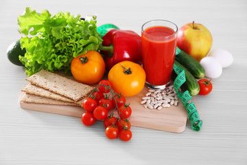 Set of fresh fruits and vegetables on wooden table closeup