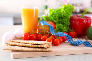 Set of fresh fruits and vegetables on wooden table closeup