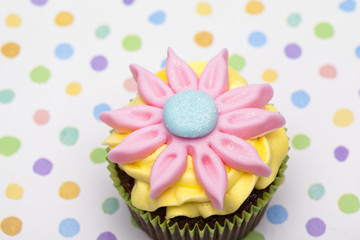 cupcake with floral pattern cream.