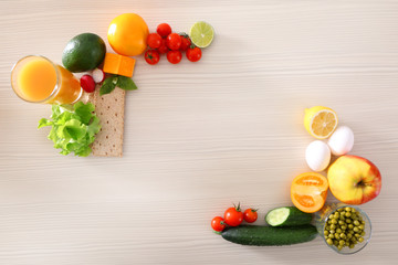 Fresh fruits and vegetables on wooden table, top view