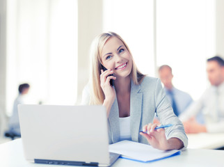 businesswoman with phone in office