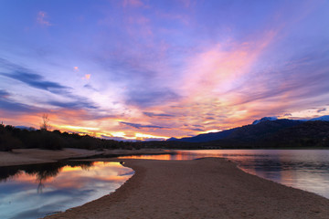 Landscape at sunset on the lake shore