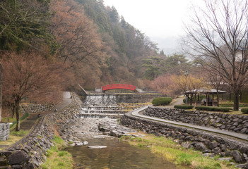 Red bridge and waterfall in Japan