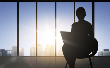 silhouette of business woman with laptop