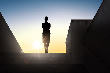 silhouette of business woman with over sun light