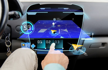 close up of man with gps navigator on car computer