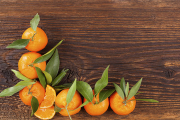 Fresh ripe mandarines on wooden table.