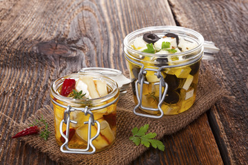 Marinated cheese in oil.