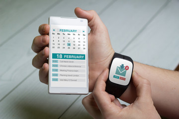 Man looking email and calendar on smart watch and phone