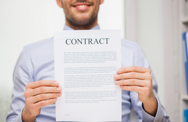 close up of businessman holding contract document