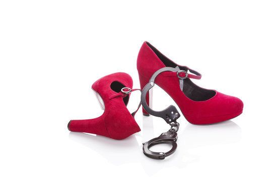 Red high heels and handcuffs.