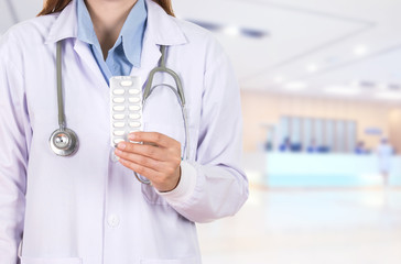 female doctor holding with pills in hospital