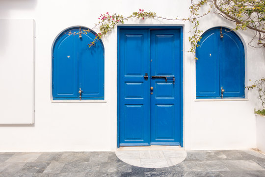 Wooden blue door and windows. Santorini. Greece