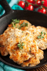 Grilled chicken meatballs on a skillet