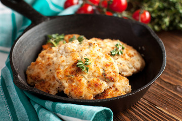 Grilled chicken meatballs on a skillet
