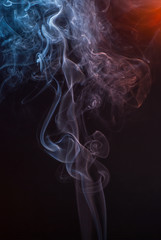 Beautiful smoke on the black background - macro photo