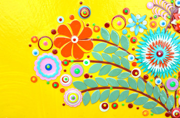 Fototapeta na wymiar Flowers on yellow abstract surface, card or print poster composition made of paint layers, quelling with die cut and scissors, abstract background painting. 3d embossing and carving.