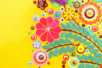 Fototapeta na wymiar Flowers on yellow abstract surface, card or print poster composition made of paint layers, quelling with die cut and scissors, abstract background painting. 3d embossing and carving.