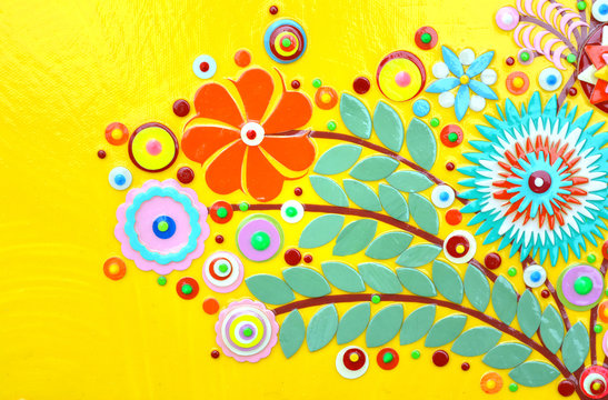 Flowers on yellow abstract surface, card or print poster composition made of paint layers, quelling with die cut and scissors, abstract background painting. 3d embossing and carving.