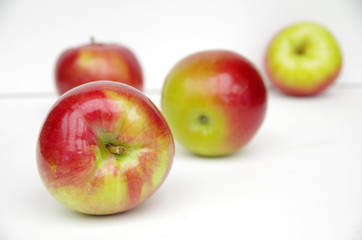 Red apples arranged in white background