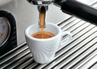 Espresso machine making a cup of coffee.