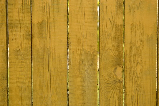 Background of yellow vertical wooden planks, space for text content, closeup