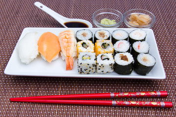 Tray of sushi on a bamboo mat