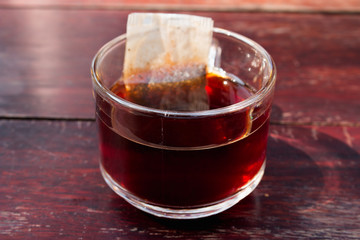 Closeup of cup of tea on vintage wood background
