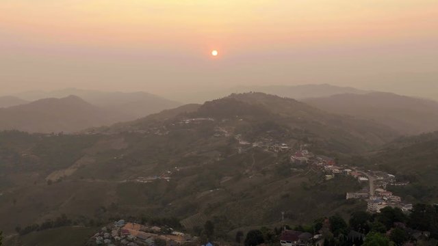 Sunset at mountain village Northern Thailand,zoom out,hot tone 