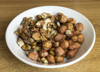 Nuts in plate on table