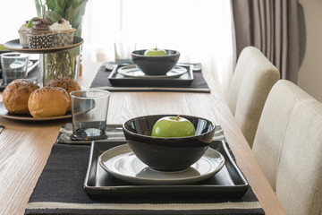 table set on wooden dinning table in modern dinning room