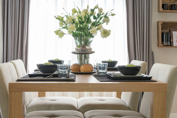 table set on wooden dinning table in modern dinning room