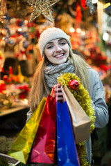 Fototapeta premium woman shopping at Christmas fair before Xmas in evening time